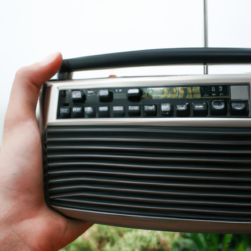 Person holding HD radio receiver